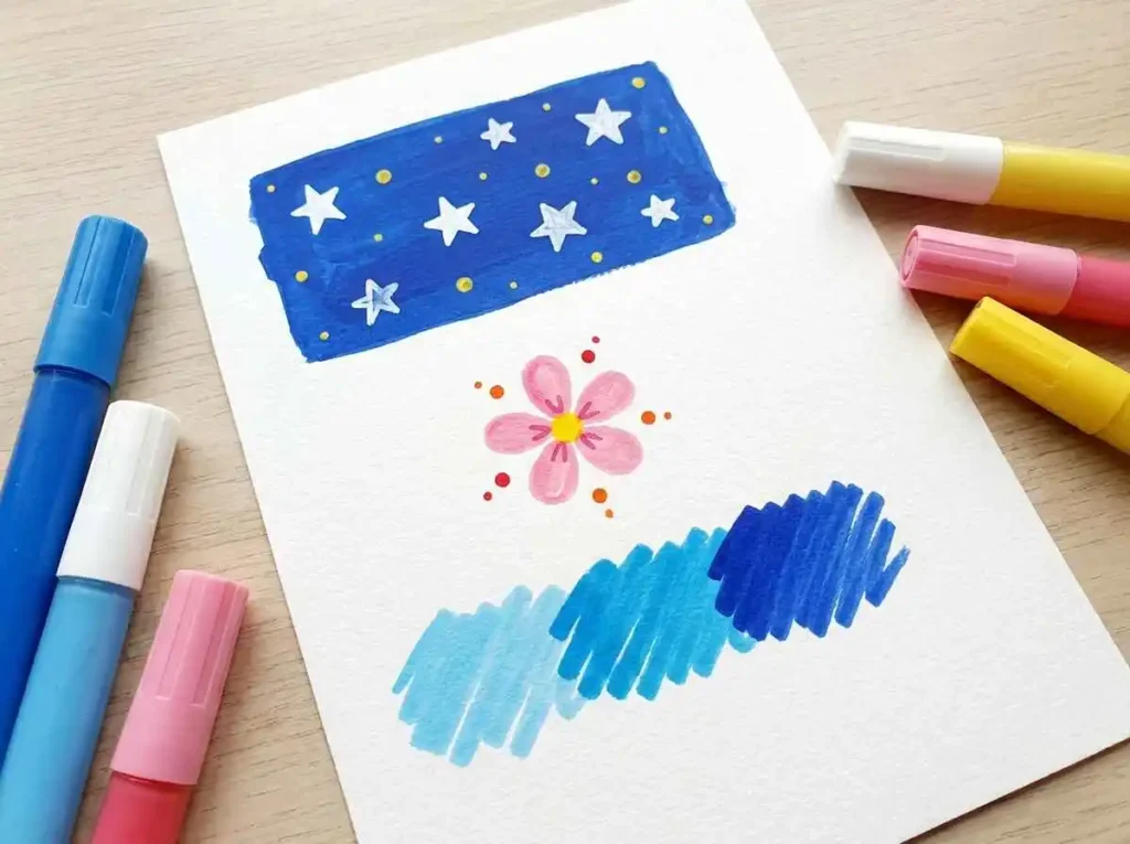 Handmade acrylic paint pen samples showing color layering, dots, and neighboring shades on paper.